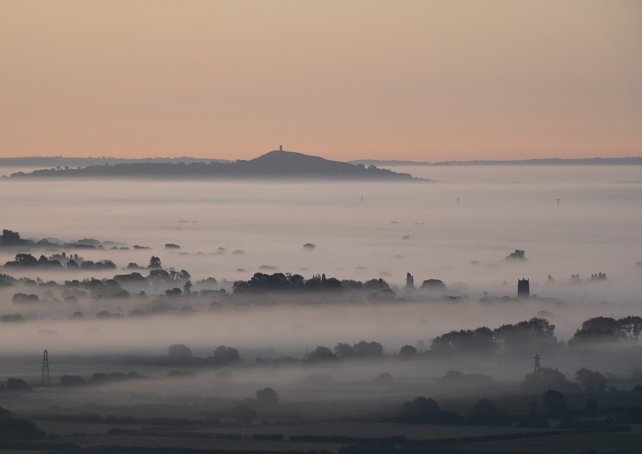 Glastonbury Tor, taken from Brent Knoll on a misty morning